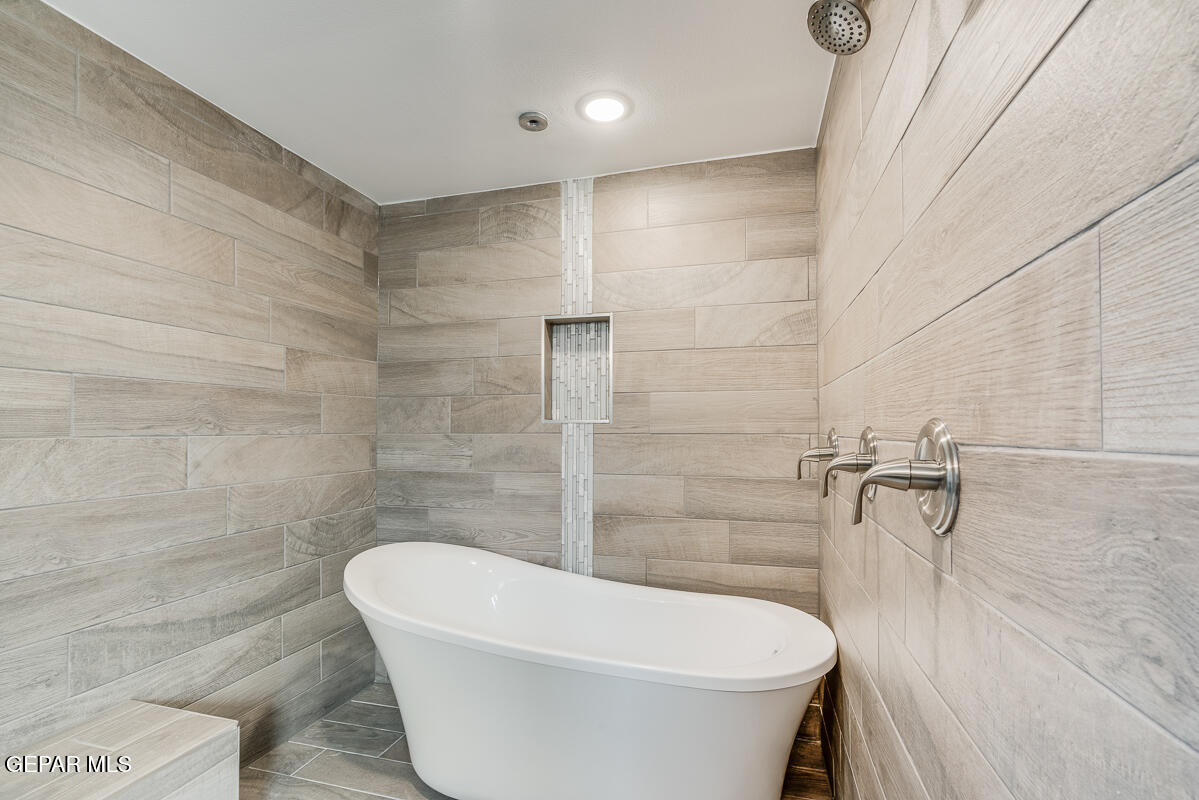 12432 Fill Ball El Paso, TX 79928 - Photo 34 of 37 a white bath tub sitting in a bathroom