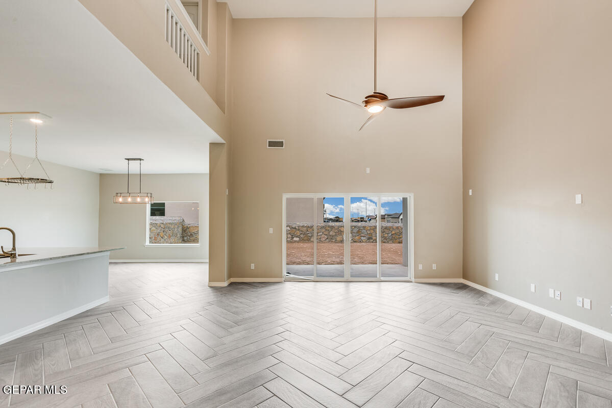 12432 Fill Ball El Paso, TX 79928 - Photo 5 of 37 a view of a entrance and room with wooden floor
