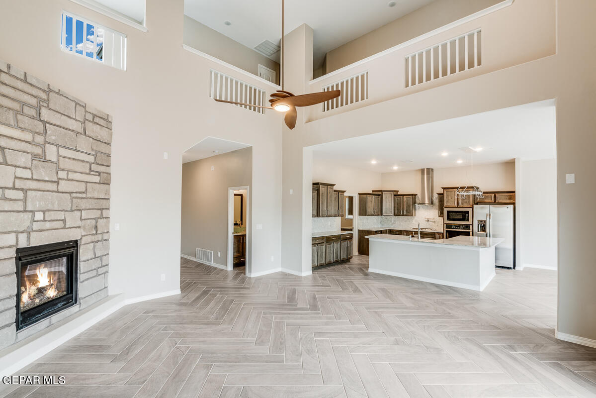 12432 Fill Ball El Paso, TX 79928 - Photo 7 of 37 a view of a kitchen with a sink and a refrigerator
