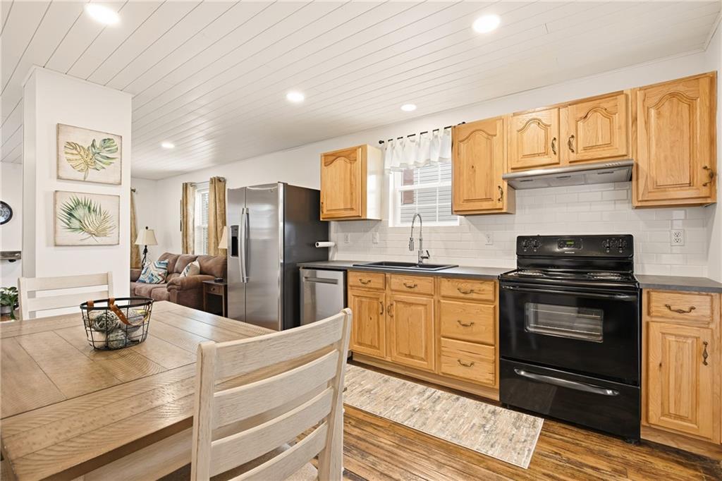 38 3rd Street Cairnbrook, PA 15924 - Photo 11 of 29 a kitchen with stainless steel appliances granite countertop a sink stove and refrigerator