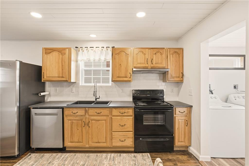 38 3rd Street Cairnbrook, PA 15924 - Photo 13 of 29 a kitchen with a sink stove and refrigerator