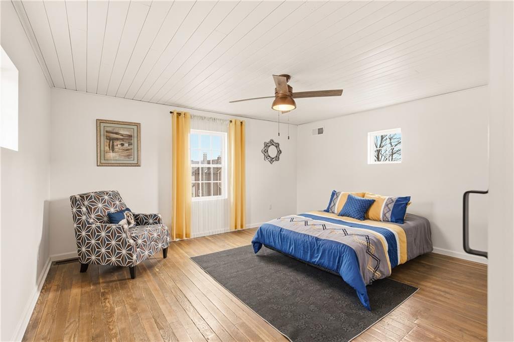38 3rd Street Cairnbrook, PA 15924 - Photo 21 of 29 a bedroom with a bed and wooden floor
