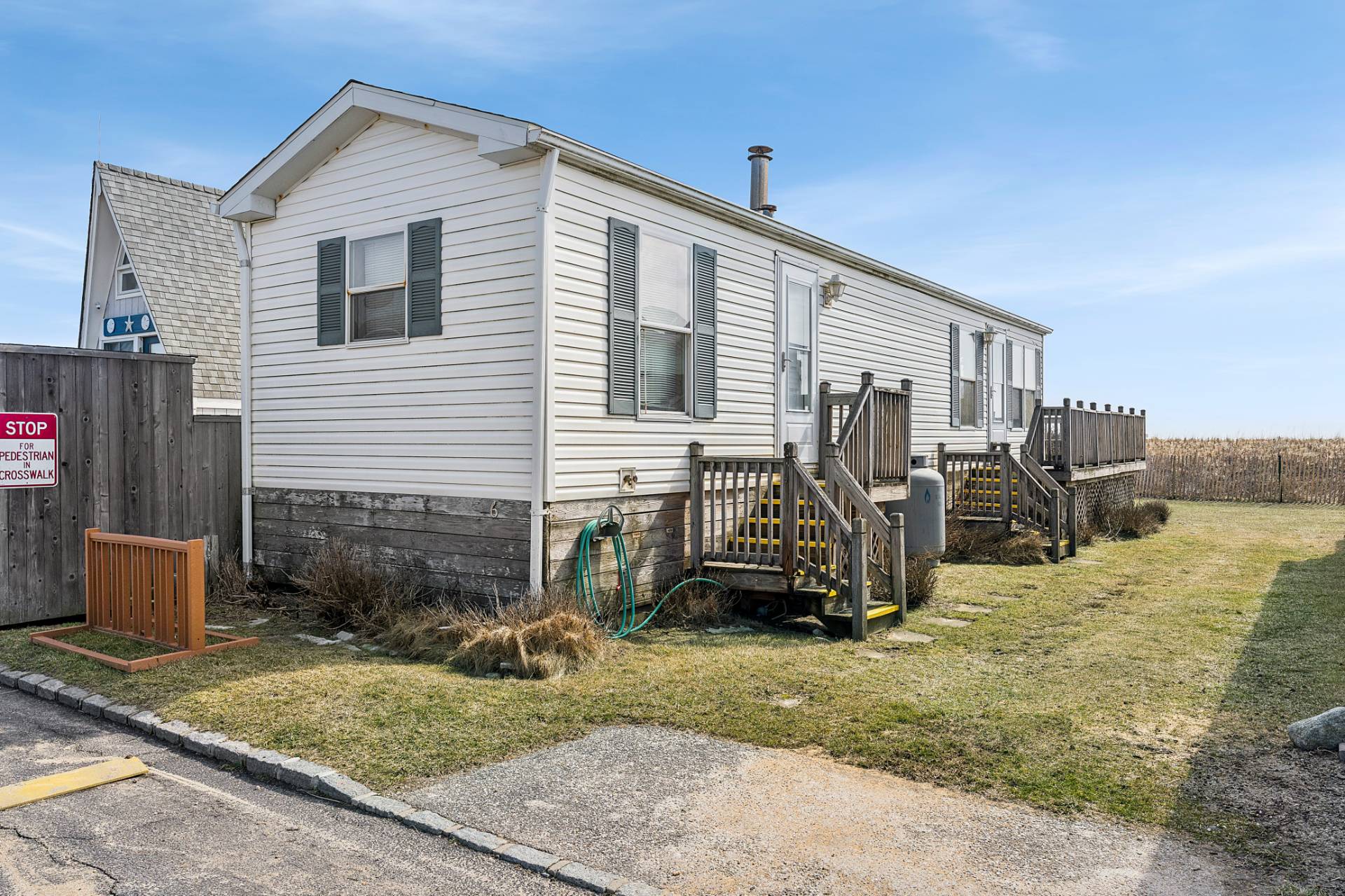 100 Deforest Road, Unit 6 Montauk, NY 11954 - Photo 3 of 6 a view of a house with a patio
