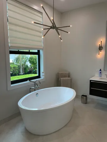 a white bath tub sitting in a bathroom