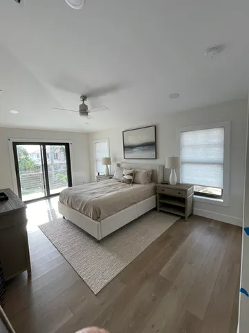 a spacious bedroom with a bed and window