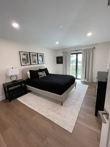 a bedroom with a bed and a tv