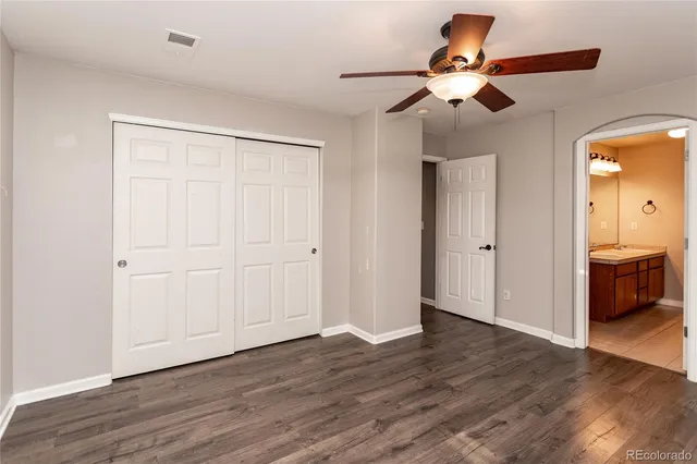 a view of an empty room and wooden floor