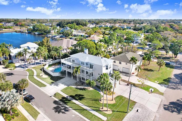 an aerial view of a houses with a yard