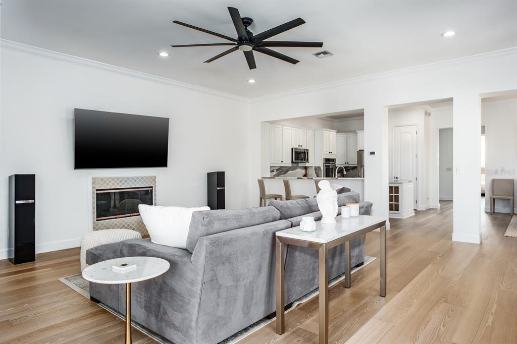 1700 Oyster Point Way Palm Harbor, FL 34683 - Photo 15 of 88 a living room with furniture and a flat screen tv