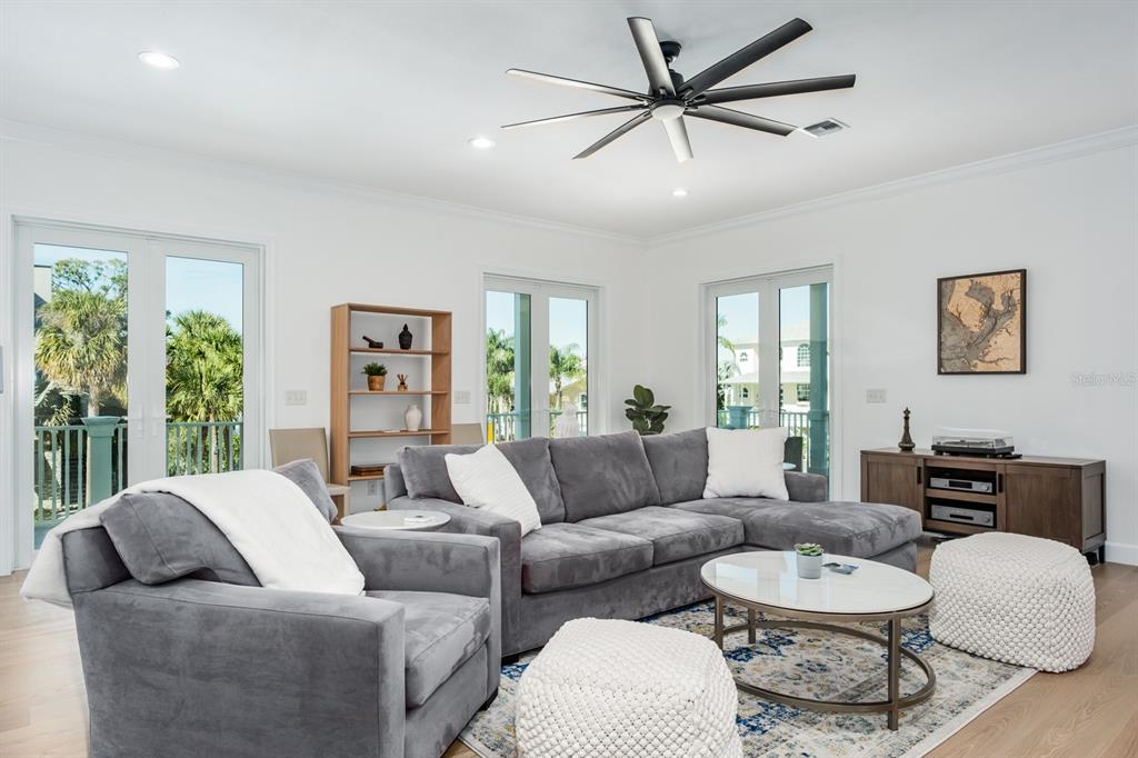 1700 Oyster Point Way Palm Harbor, FL 34683 - Photo 16 of 88 a living room with furniture and a large window