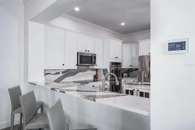 a bedroom with a bed and flat screen tv