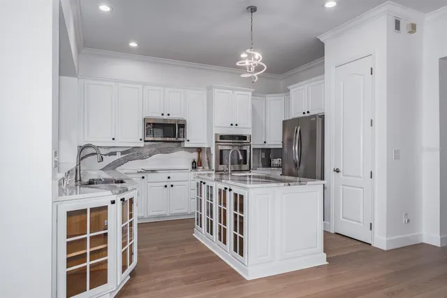a bathroom with a double vanity sink a bathtub and window