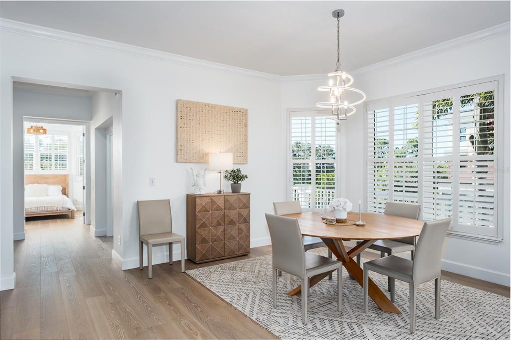 1700 Oyster Point Way Palm Harbor, FL 34683 - Photo 27 of 88 a view of a dining room with furniture window and wooden floor