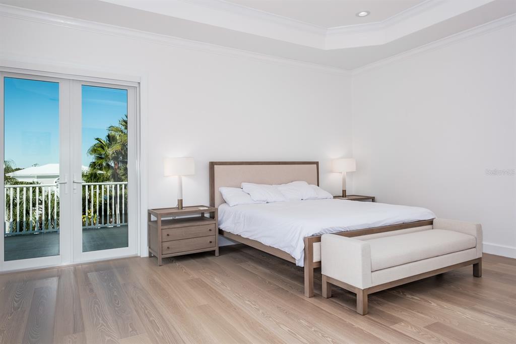 1700 Oyster Point Way Palm Harbor, FL 34683 - Photo 32 of 88 a bedroom with a bed and a table