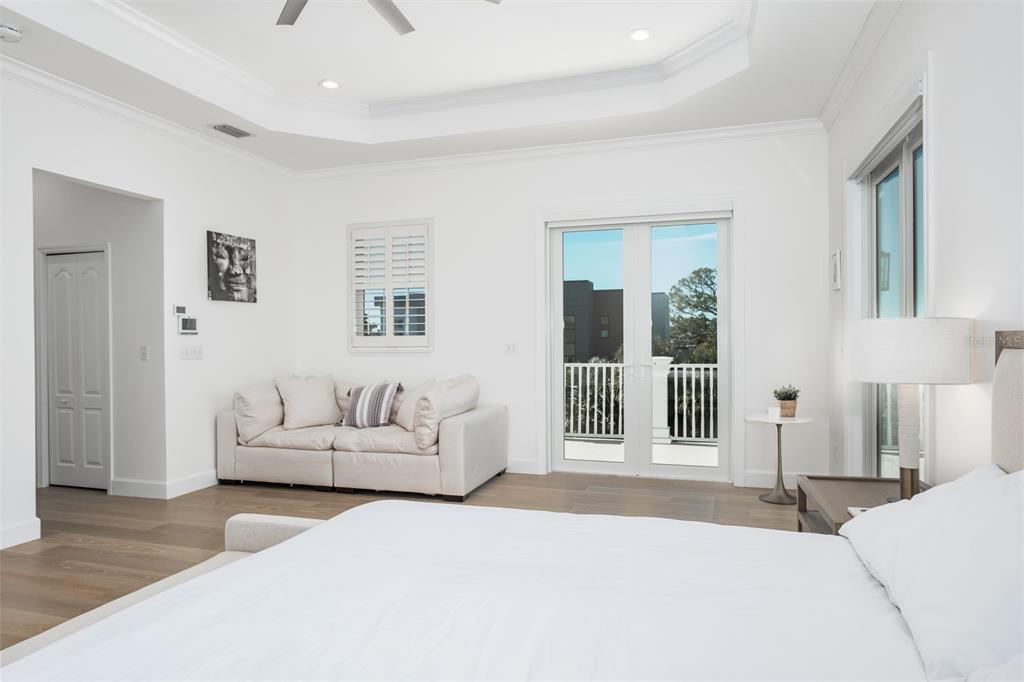 1700 Oyster Point Way Palm Harbor, FL 34683 - Photo 34 of 88 a bedroom with a large bed and a couch