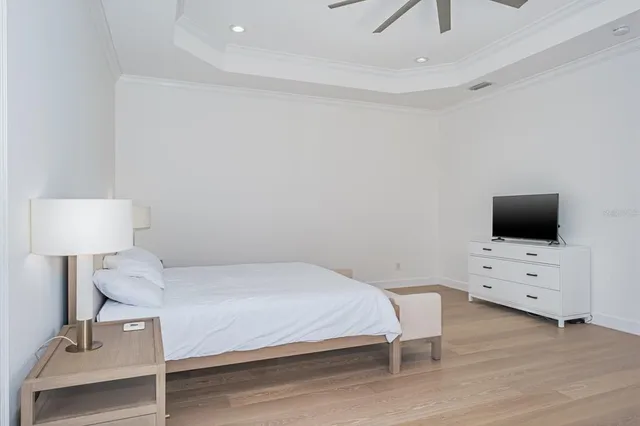 a bedroom with a bed and a couch