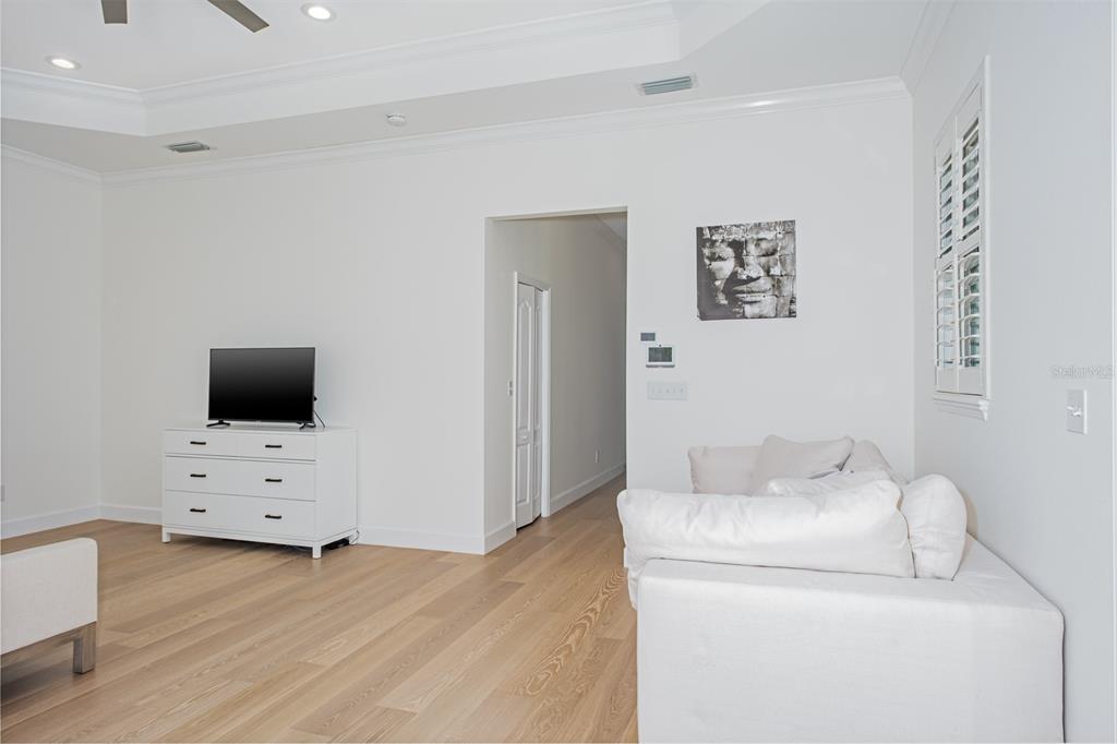 1700 Oyster Point Way Palm Harbor, FL 34683 - Photo 36 of 88 a room with furniture and flat screen tv