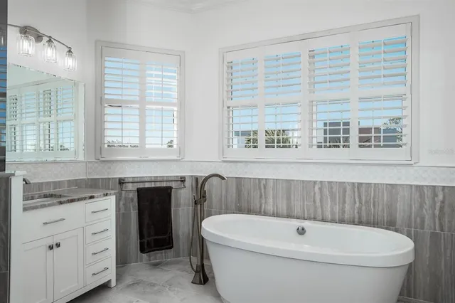 a view of a livingroom with furniture and a flat screen tv