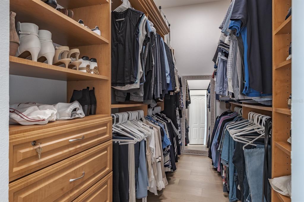 1700 Oyster Point Way Palm Harbor, FL 34683 - Photo 41 of 88 a view of walk in closet with clothes and shoes
