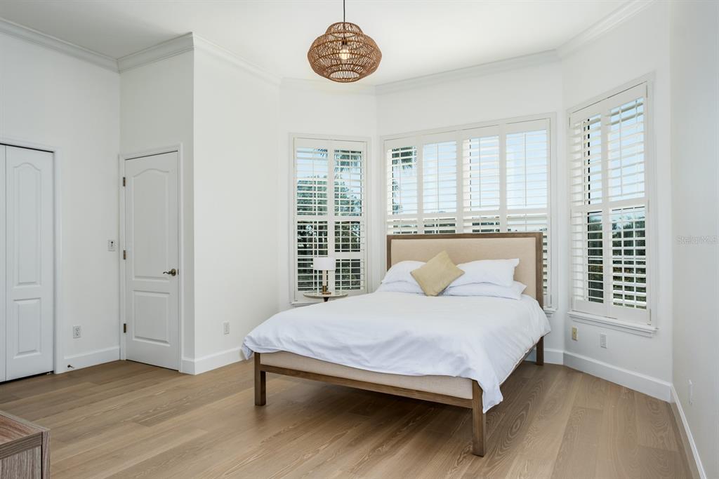 1700 Oyster Point Way Palm Harbor, FL 34683 - Photo 42 of 88 a bedroom with a bed and a window