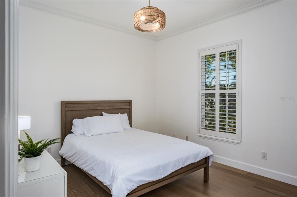 1700 Oyster Point Way Palm Harbor, FL 34683 - Photo 46 of 88 a bedroom with a bed and a window