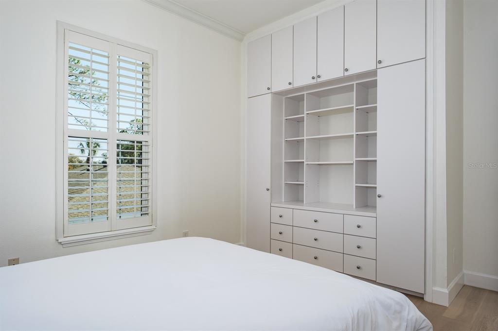 1700 Oyster Point Way Palm Harbor, FL 34683 - Photo 47 of 88 a bedroom with a bed and a window