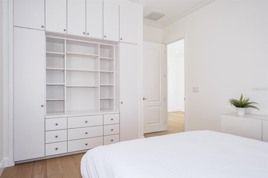 1700 Oyster Point Way Palm Harbor, FL 34683 - Photo 48 of 88 a bedroom with a bed and a window