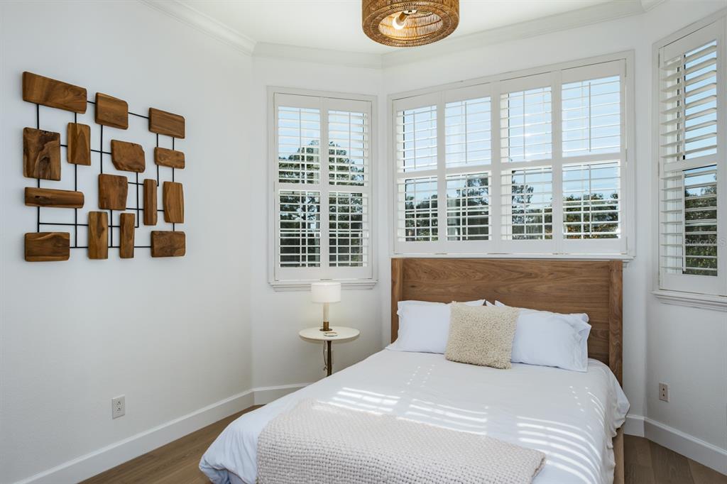 1700 Oyster Point Way Palm Harbor, FL 34683 - Photo 49 of 88 a bedroom with a bed and a window