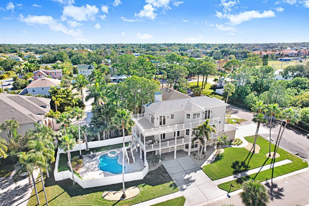 1700 Oyster Point Way Palm Harbor, FL 34683 - Photo 5 of 88 an aerial view of a house with garden space and outdoor seating