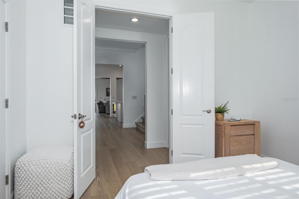 1700 Oyster Point Way Palm Harbor, FL 34683 - Photo 51 of 88 a bedroom with a bed and a couch