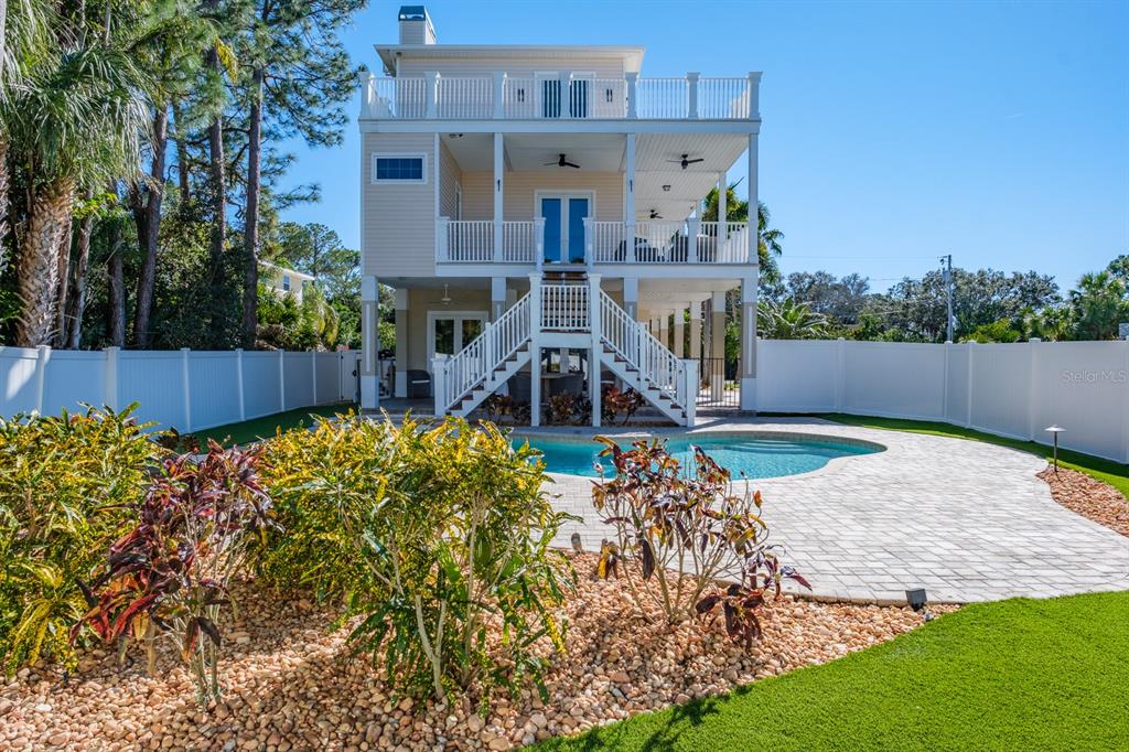 1700 Oyster Point Way Palm Harbor, FL 34683 - Photo 58 of 88 front view of a house with a yard