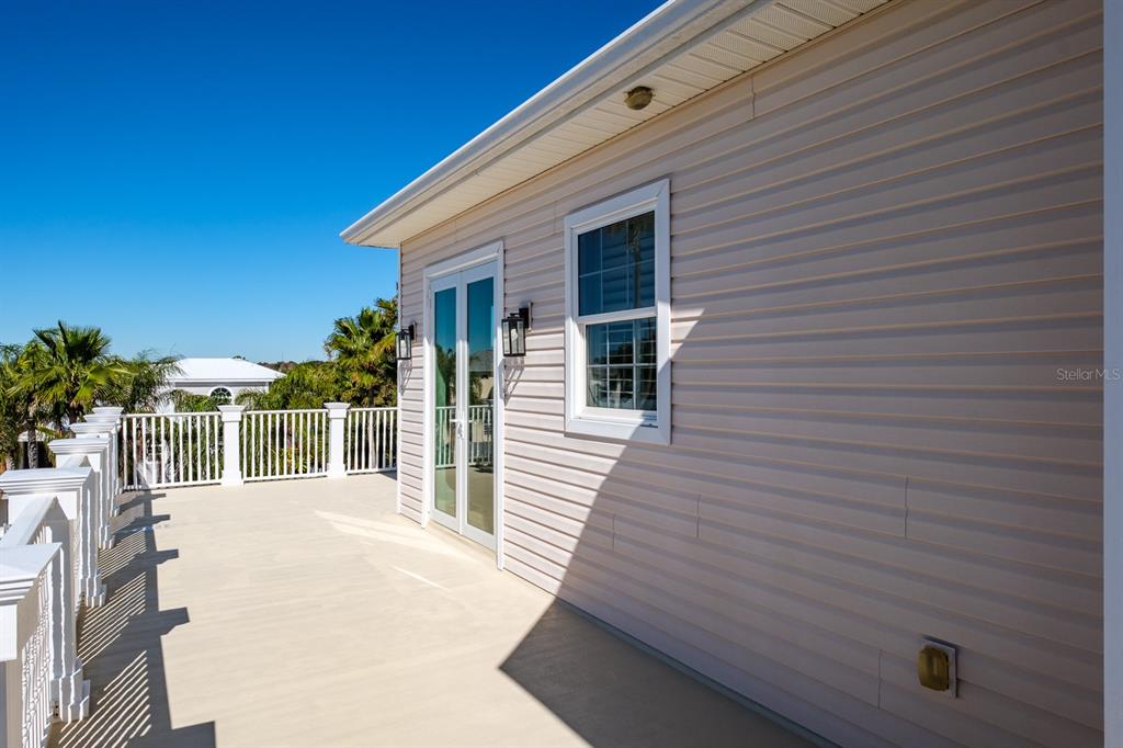 1700 Oyster Point Way Palm Harbor, FL 34683 - Photo 68 of 88 a view of a house with a backyard