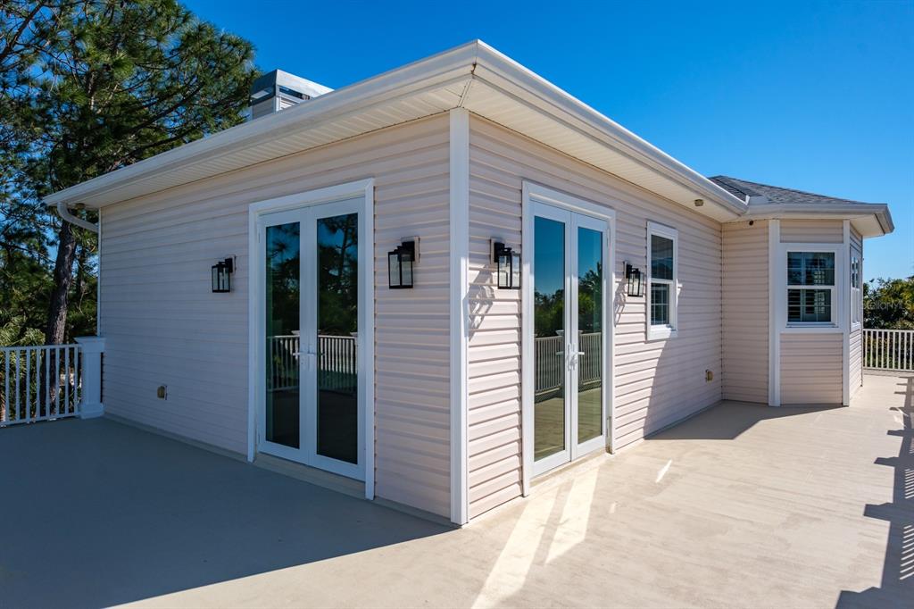 1700 Oyster Point Way Palm Harbor, FL 34683 - Photo 69 of 88 a view of a house with a porch