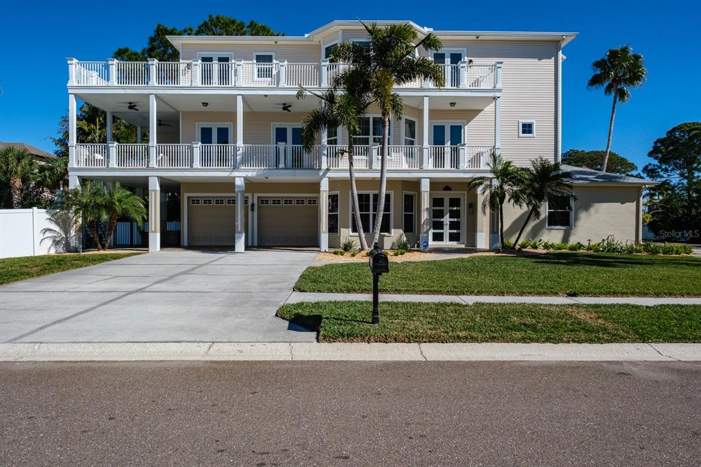 1700 Oyster Point Way Palm Harbor, FL 34683 - Photo 7 of 88 a front view of building with yard