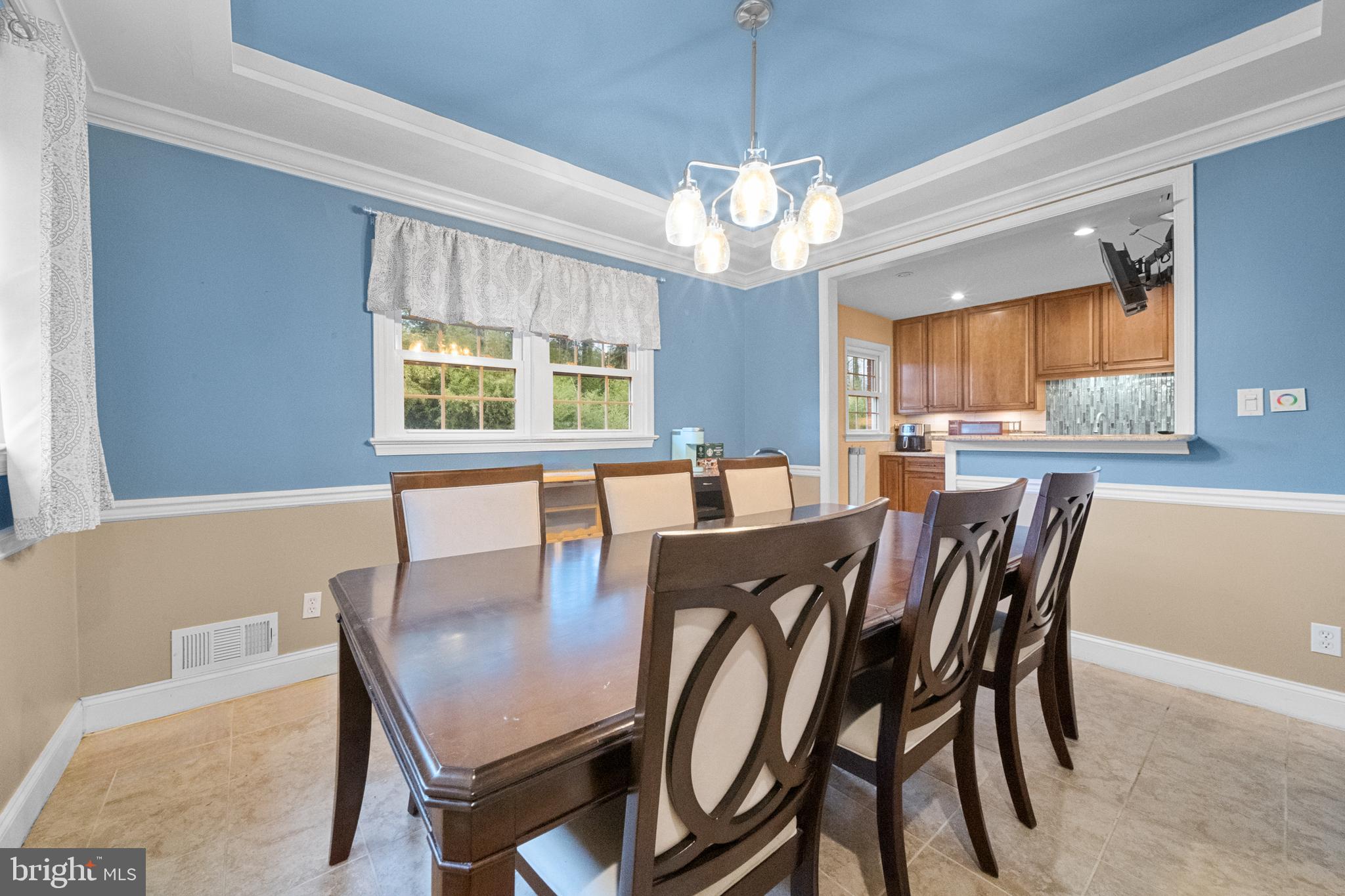 10600 Springmann Drive Fairfax, VA 22030 - Photo 14 of 78 a view of a dining room with furniture a chandelier and wooden floor