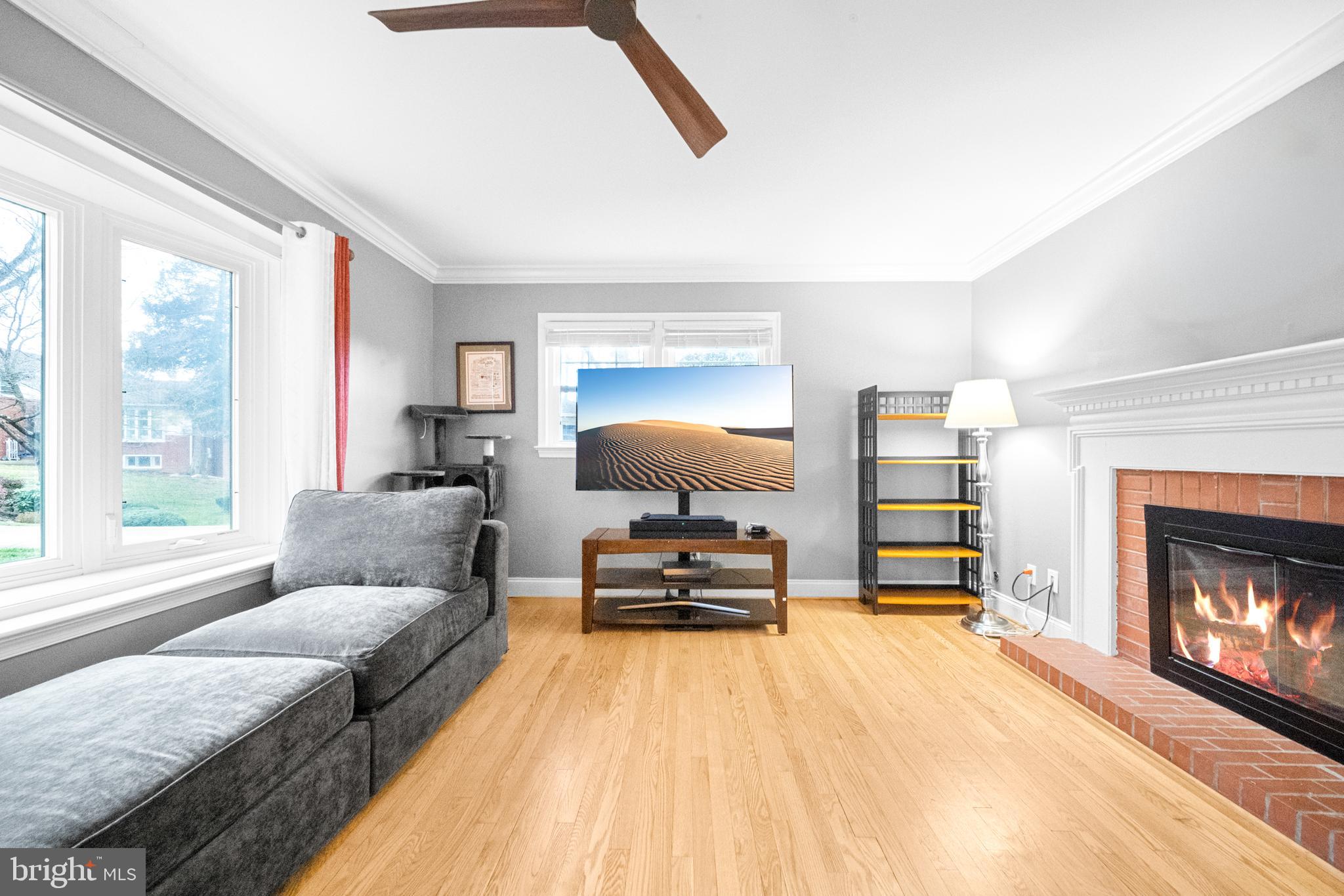 10600 Springmann Drive Fairfax, VA 22030 - Photo 24 of 78 a bedroom with a bed and a fireplace