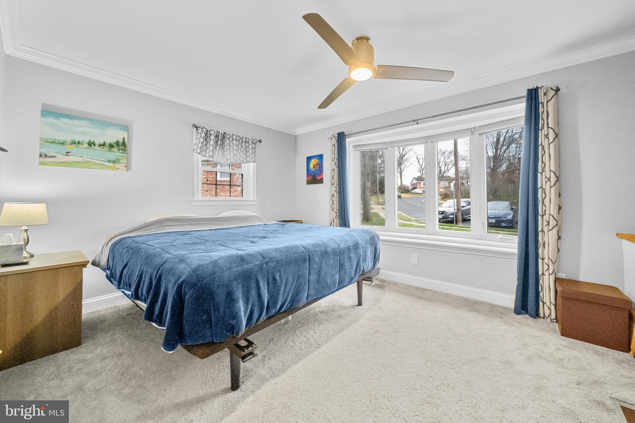 10600 Springmann Drive Fairfax, VA 22030 - Photo 28 of 78 a spacious bedroom with a large bed and a large window