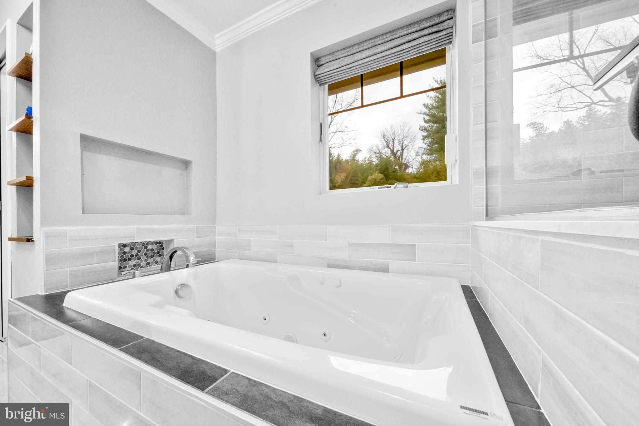 10600 Springmann Drive Fairfax, VA 22030 - Photo 34 of 78 a white bath tub sitting next to a window