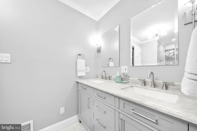 a bedroom with a bed dresser and a window