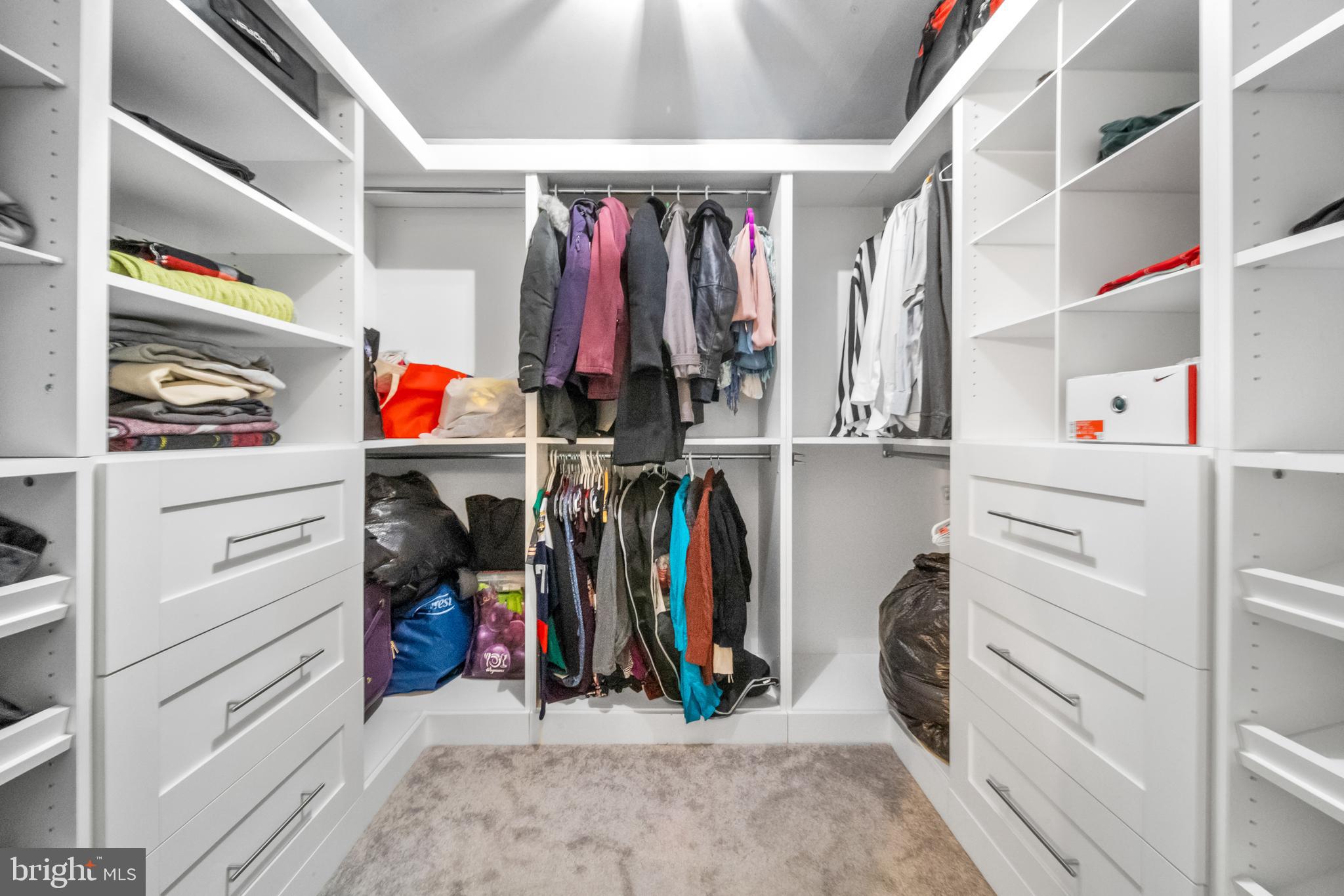 10600 Springmann Drive Fairfax, VA 22030 - Photo 37 of 78 a view of walk in closet with clothes and shoes