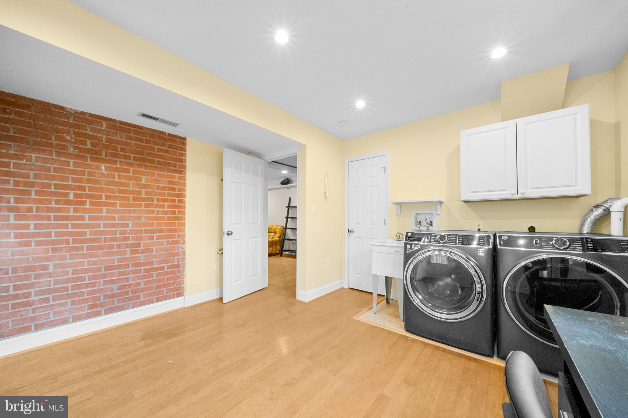 10600 Springmann Drive Fairfax, VA 22030 - Photo 49 of 78 a view of a kitchen with a washer and dryer