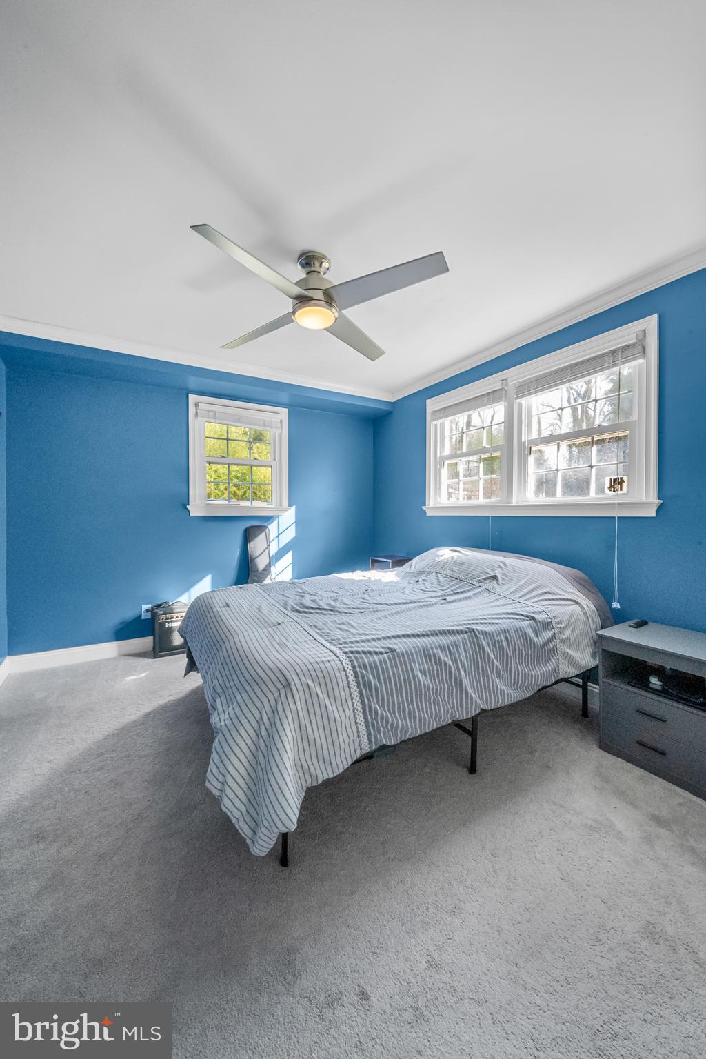 10600 Springmann Drive Fairfax, VA 22030 - Photo 51 of 78 a bedroom with a bed dresser and a window