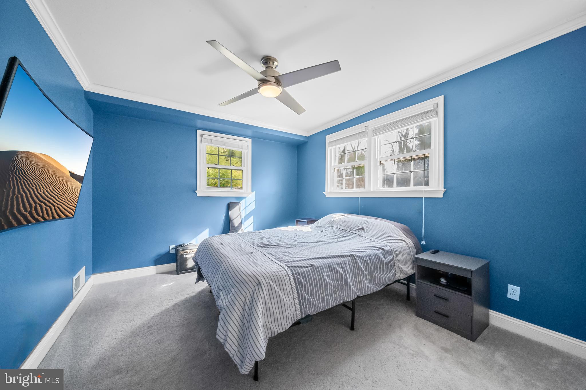 10600 Springmann Drive Fairfax, VA 22030 - Photo 52 of 78 a bedroom with a bed and a window