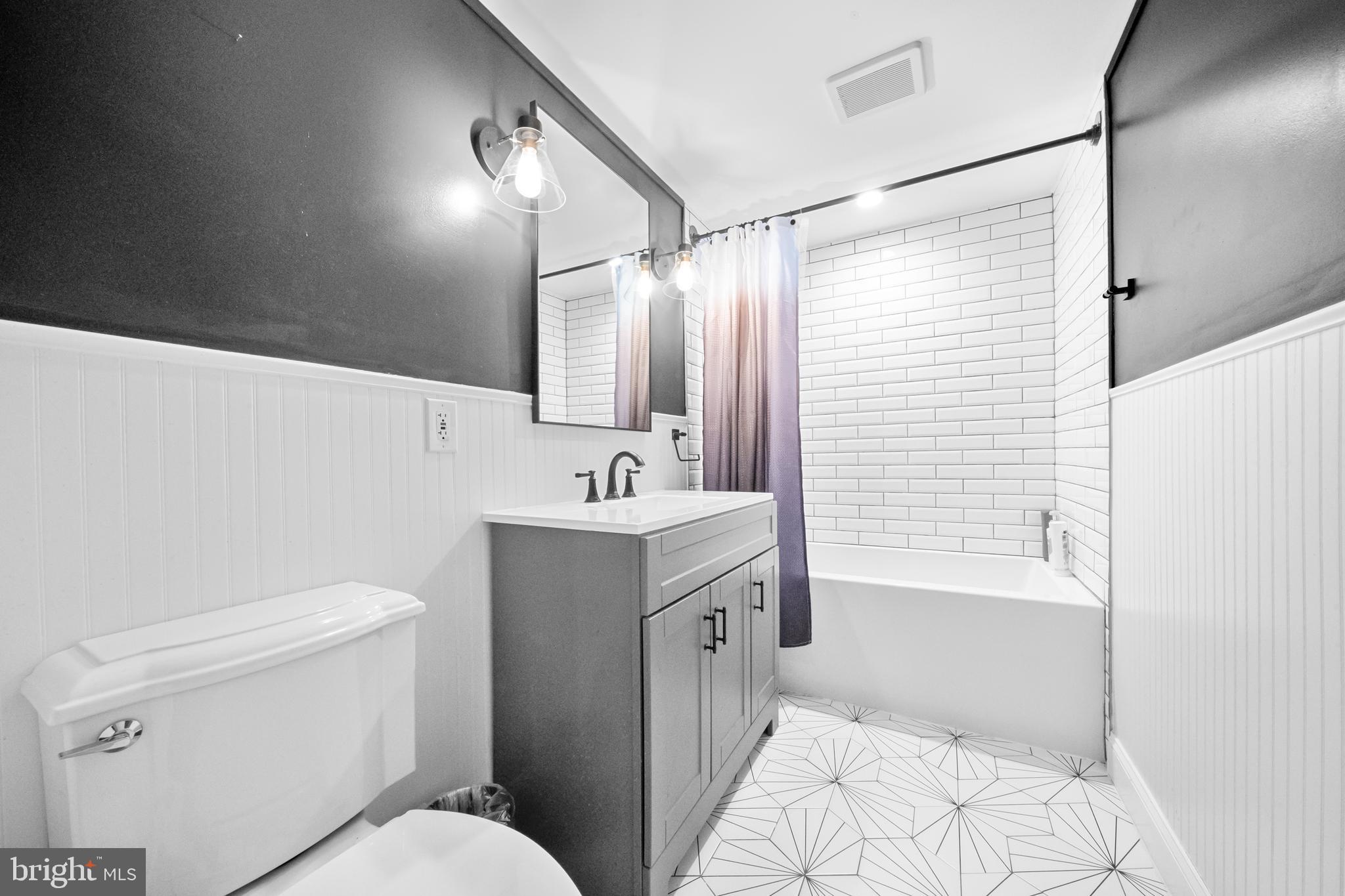 10600 Springmann Drive Fairfax, VA 22030 - Photo 53 of 78 a bathroom with a sink toilet and shower