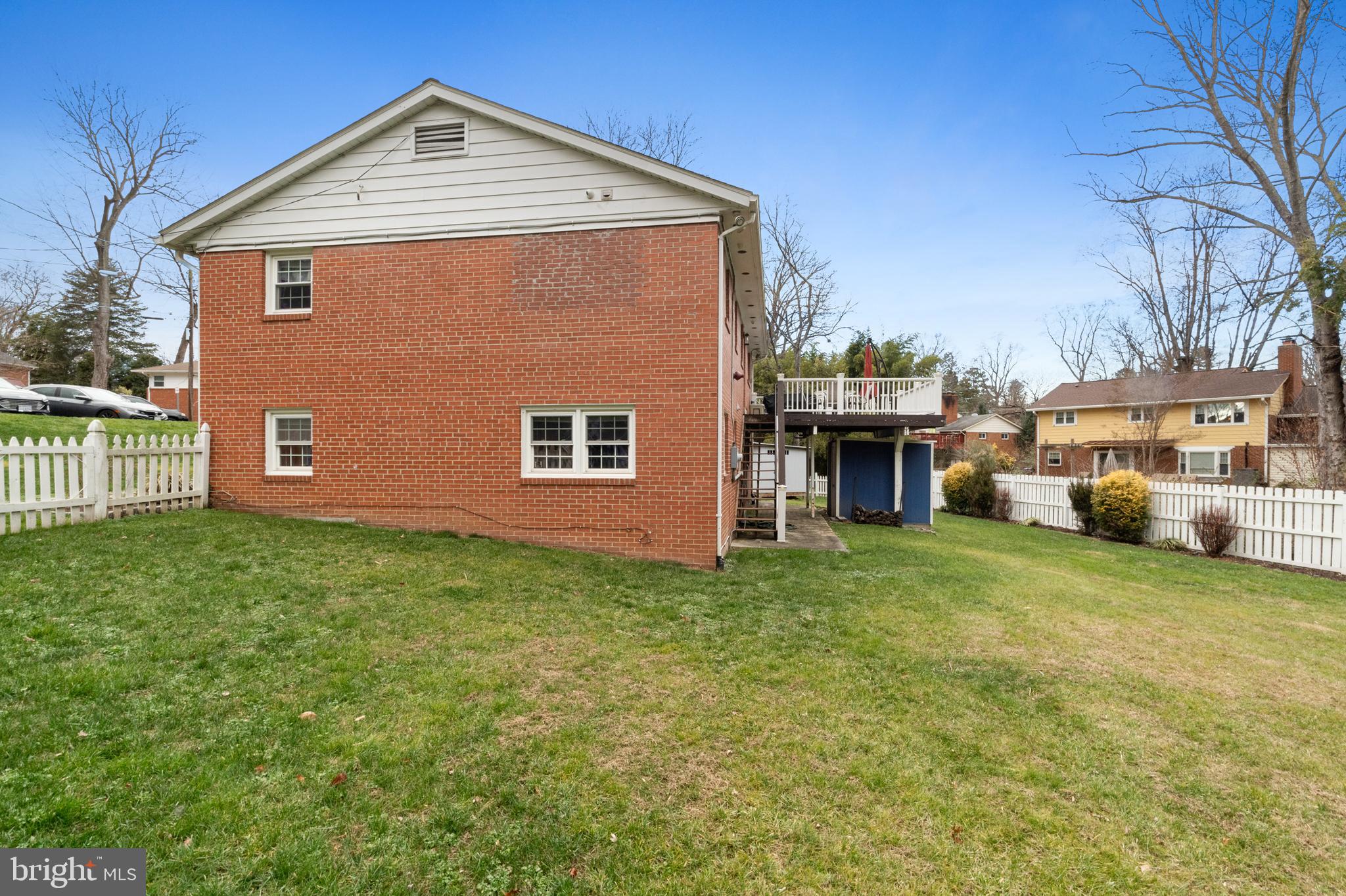 10600 Springmann Drive Fairfax, VA 22030 - Photo 72 of 78 a front view of a house with a garden