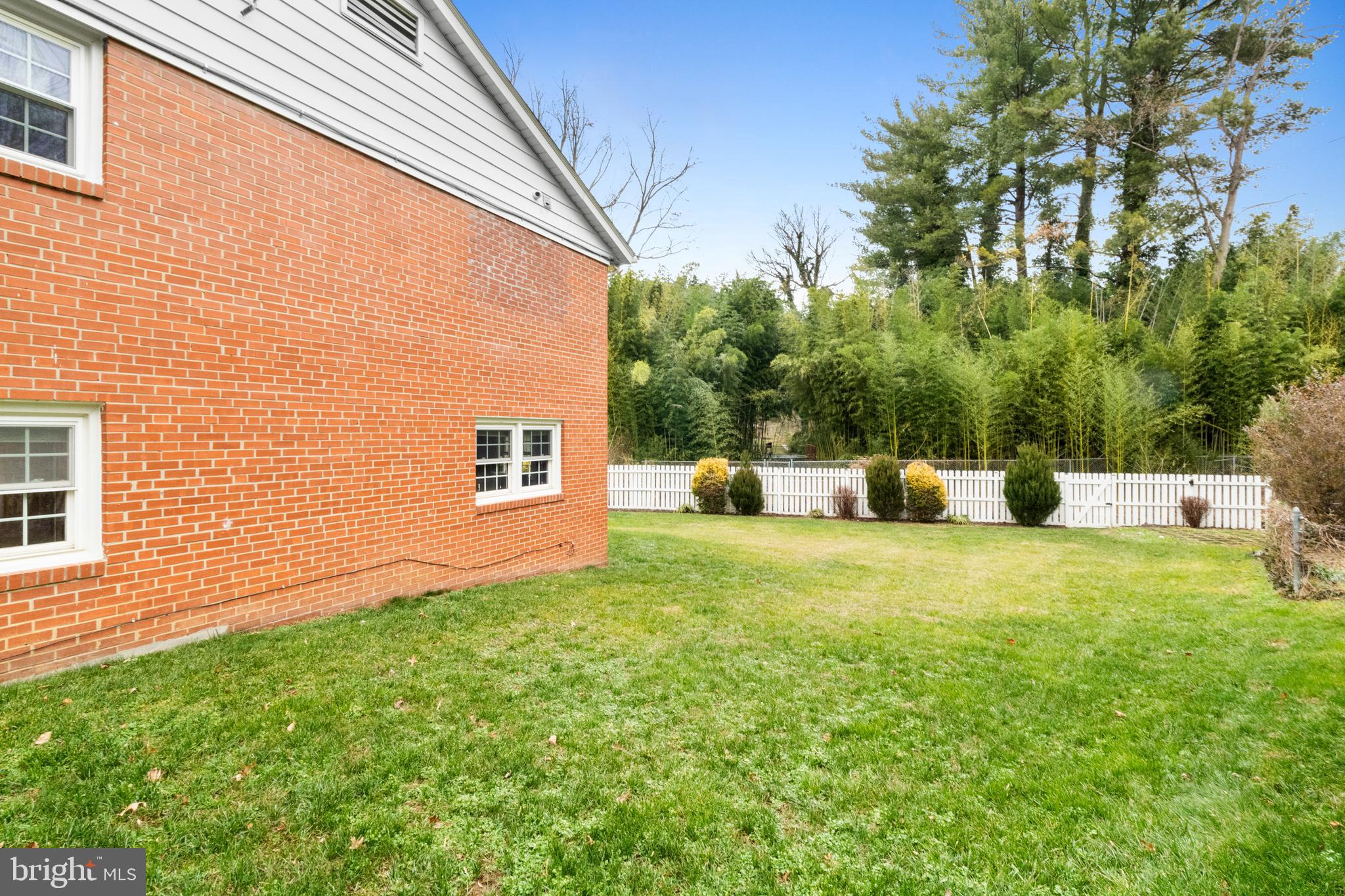 10600 Springmann Drive Fairfax, VA 22030 - Photo 74 of 78 a backyard of a house with table and chairs