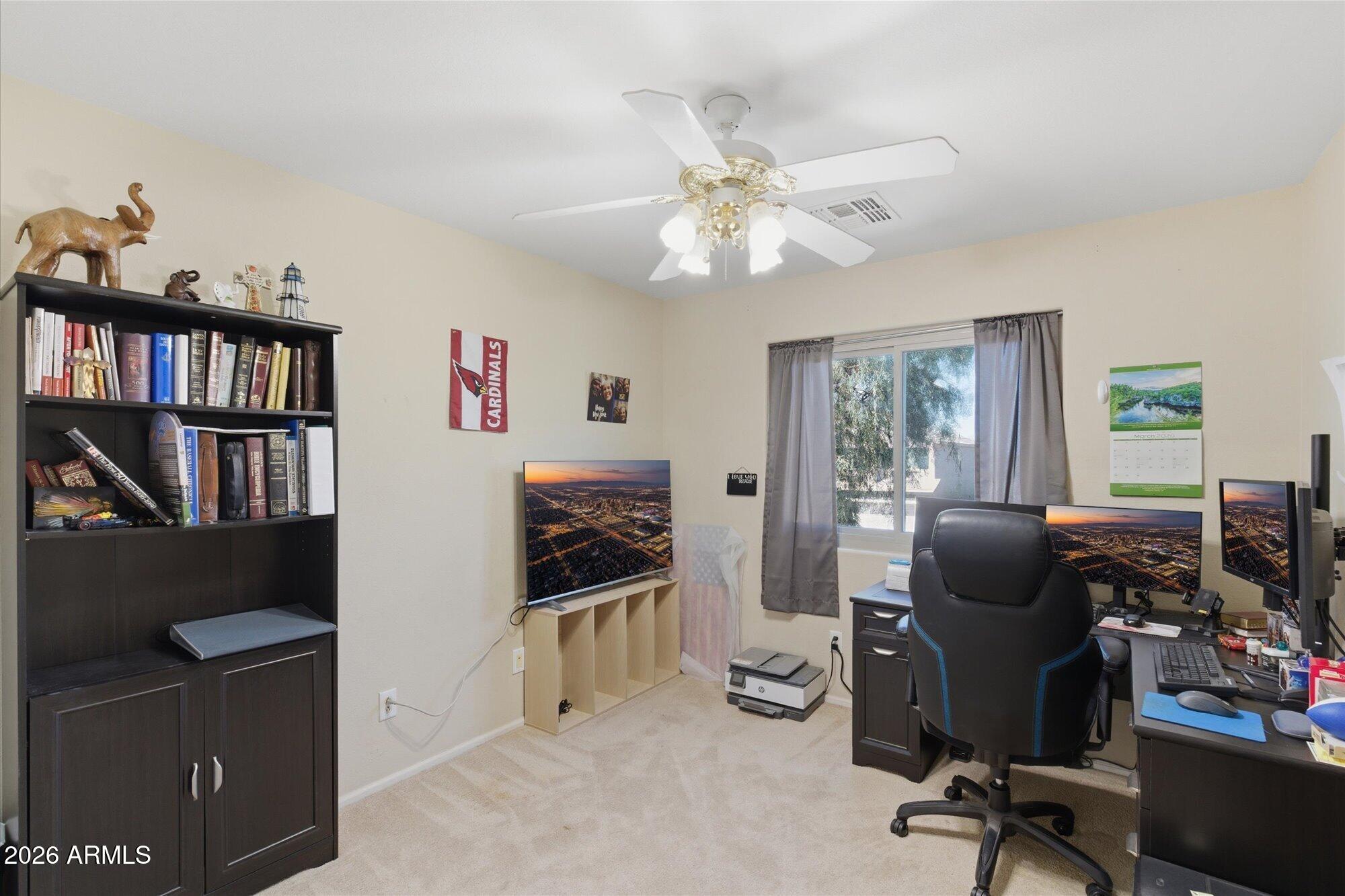 21915 Dietz Drive Maricopa, AZ 85138 - Photo 24 of 31 a view of a workspace with furniture and a workspace
