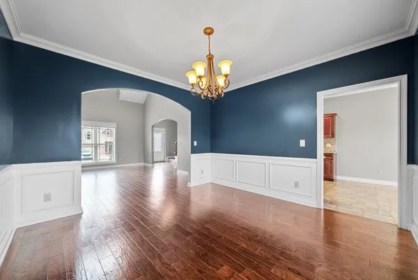 a kitchen with stainless steel appliances granite countertop a refrigerator and a stove