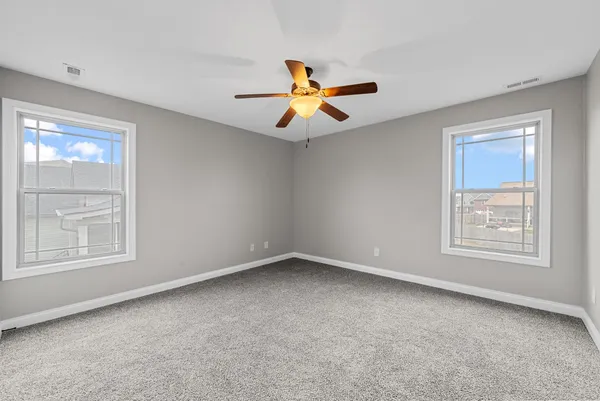 a view of a big room with table and chairs