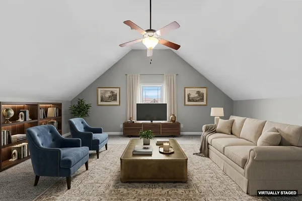 a view of a house with a yard and sitting area